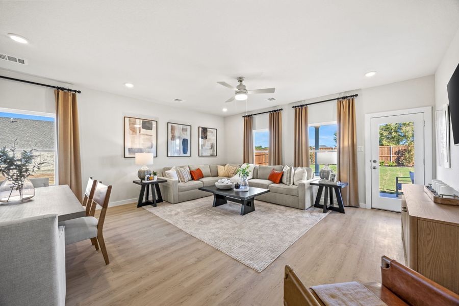 A living room with a large window. A living room with a large window.