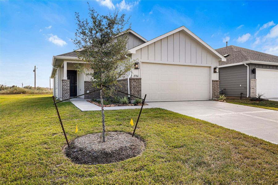 Front exterior of a new home in , Splendora, TX, highlighting curb appeal (Image 17).