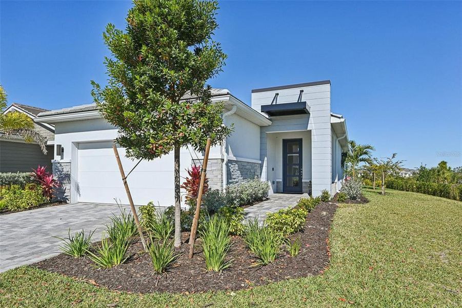 Front exterior of a new home in , Venice, FL, highlighting curb appeal (Image 24).