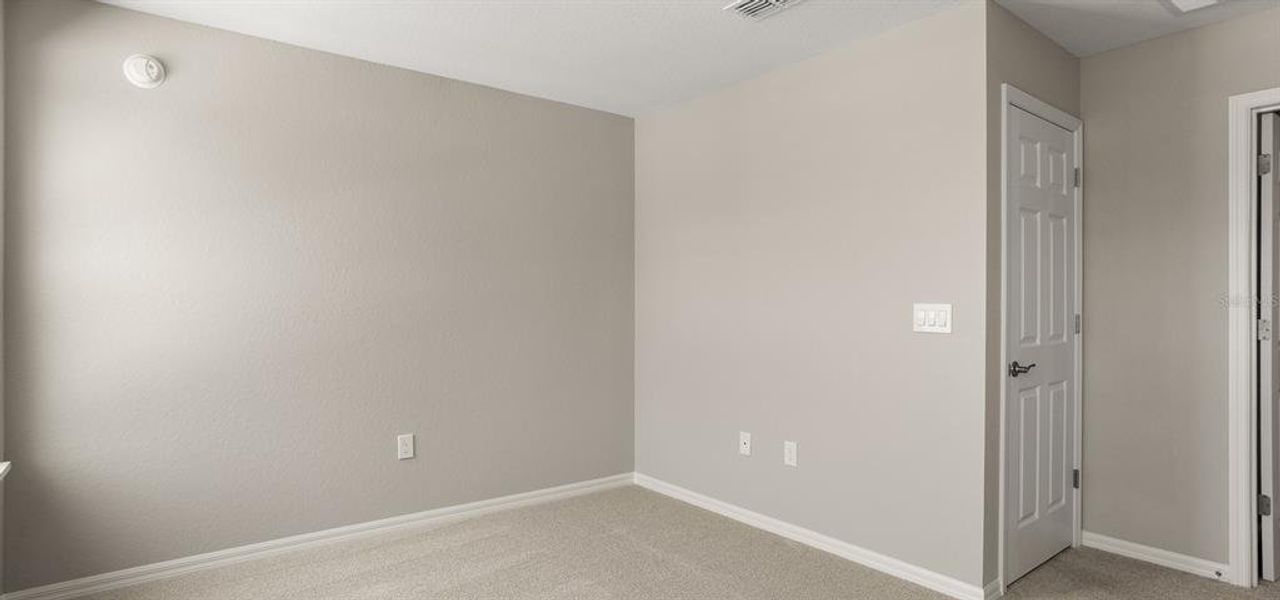 Spacious, unfurnished interior of a new home in Harbor at Lake Henry - Townhomes, Winter Haven (Image 21).