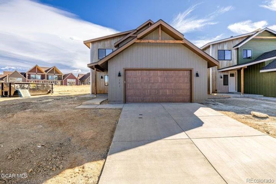 Front exterior of a new home in , Granby, CO, highlighting curb appeal (Image 28).