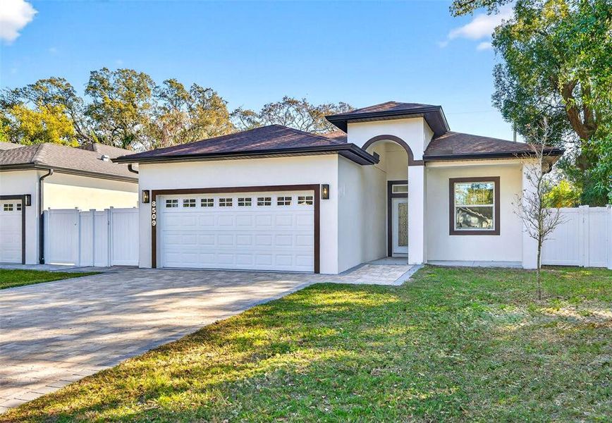 Front exterior of a new home in , Tampa, FL, highlighting curb appeal (Image 1). Front exterior of a new home in , Tampa, FL, highlighting curb appeal (Image 1).