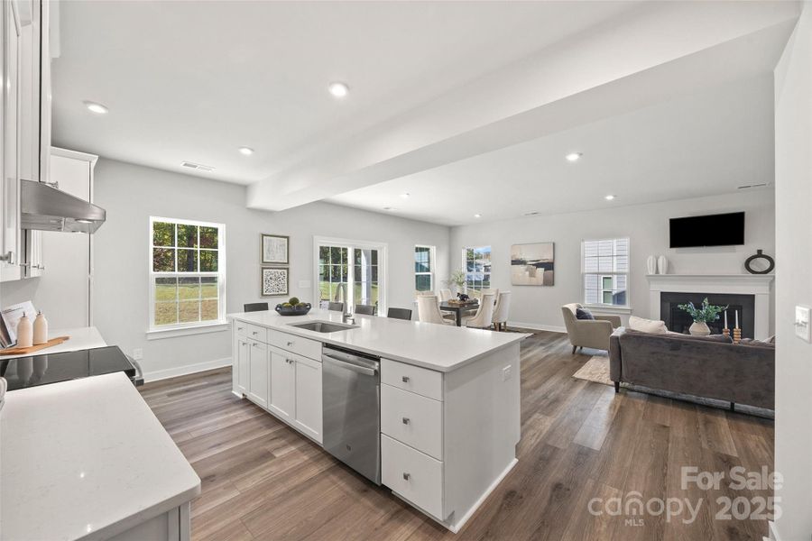 Kitchen with large quartz countertop island Kitchen with large quartz countertop island