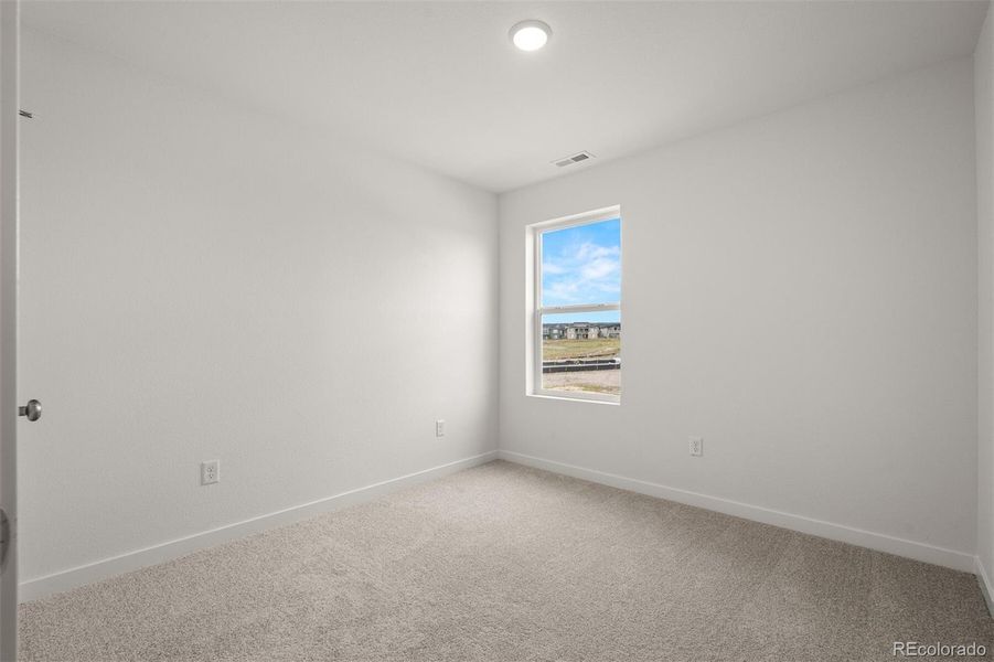 Spacious, unfurnished interior of a new home in Revel Crossing at Wolf Ranch – The Ascent Collection, Colorado Springs (Image 16).