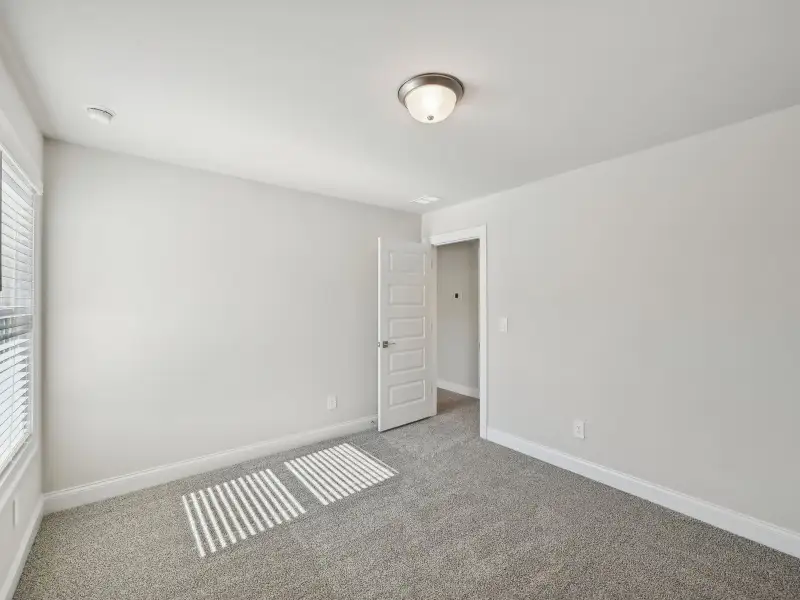 Spacious, unfurnished interior of a new home in Martin Springs - Cottage Series, Lawrenceville (Image 18).