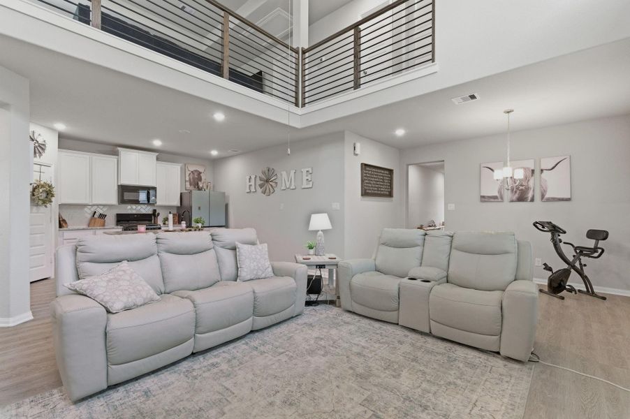 Open concept living, kitchen, and dining spaces