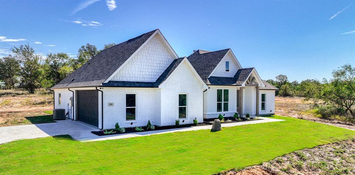 Front exterior of a new home in , Weatherford, TX, highlighting curb appeal (Image 2). Front exterior of a new home in , Weatherford, TX, highlighting curb appeal (Image 2).