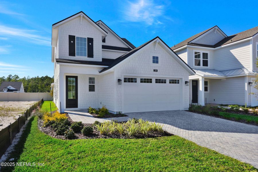 Front exterior of a new home in Seabrook Village at Seabrook, Ponte Vedra, FL, highlighting curb appeal (Image 23).