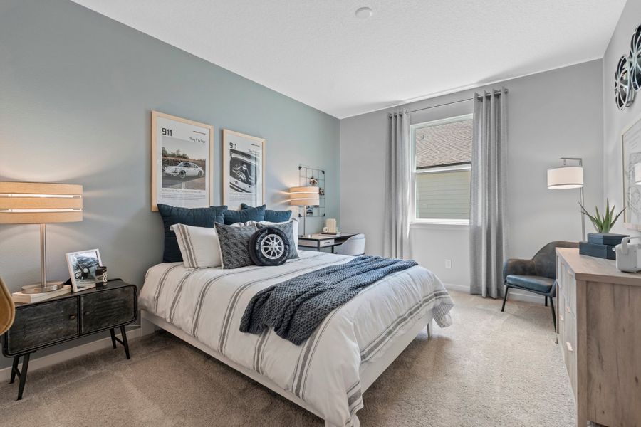 Coronado Model Home Guest Bedroom with Bed and Desk at Reserve East in Flagler Beach Coronado Model Home Guest Bedroom with Bed and Desk at Reserve East in Flagler Beach