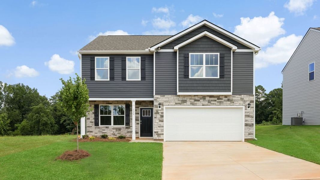 Front exterior of a new home in Waverly Station, Greenwood, SC, highlighting curb appeal (Image 1). Front exterior of a new home in Waverly Station, Greenwood, SC, highlighting curb appeal (Image 1).