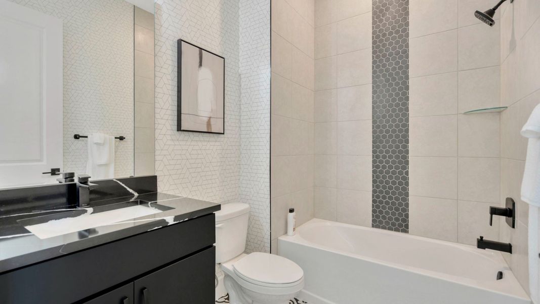 The Third Bathroom of a DRB Homes Grand Eider model, which is a home plan offered at Serengeti in Spring Hill, FL.