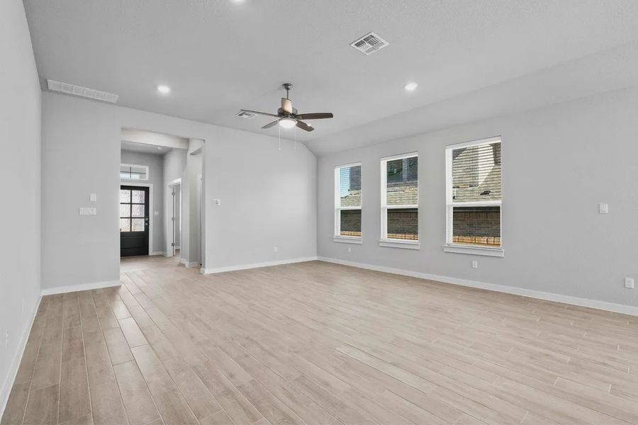 Representative unfurnished interior of a home built from the Cooper by Chesmar Homes in Carillon, Boerne (Image 6).