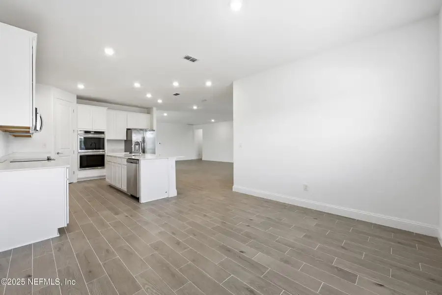 Spacious, unfurnished interior of a new home in Edenbrooke at Hyland Trail | 55+: Edenbrooke at Hyland Trail 60s, Green Cove Springs (Image 14). Spacious, unfurnished interior of a new home in Edenbrooke at Hyland Trail | 55+: Edenbrooke at Hyland Trail 60s, Green Cove Springs (Image 14).