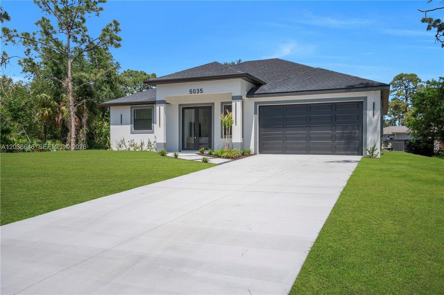 Front exterior of a new home in , Labelle, FL, highlighting curb appeal (Image 2). Front exterior of a new home in , Labelle, FL, highlighting curb appeal (Image 2).