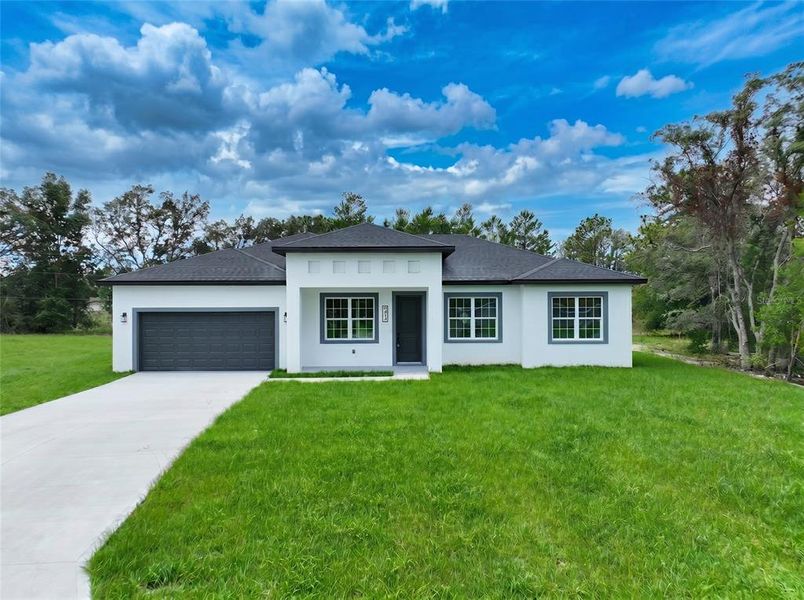 Front exterior of a new home in , Ocala, FL, highlighting curb appeal (Image 1). Front exterior of a new home in , Ocala, FL, highlighting curb appeal (Image 1).