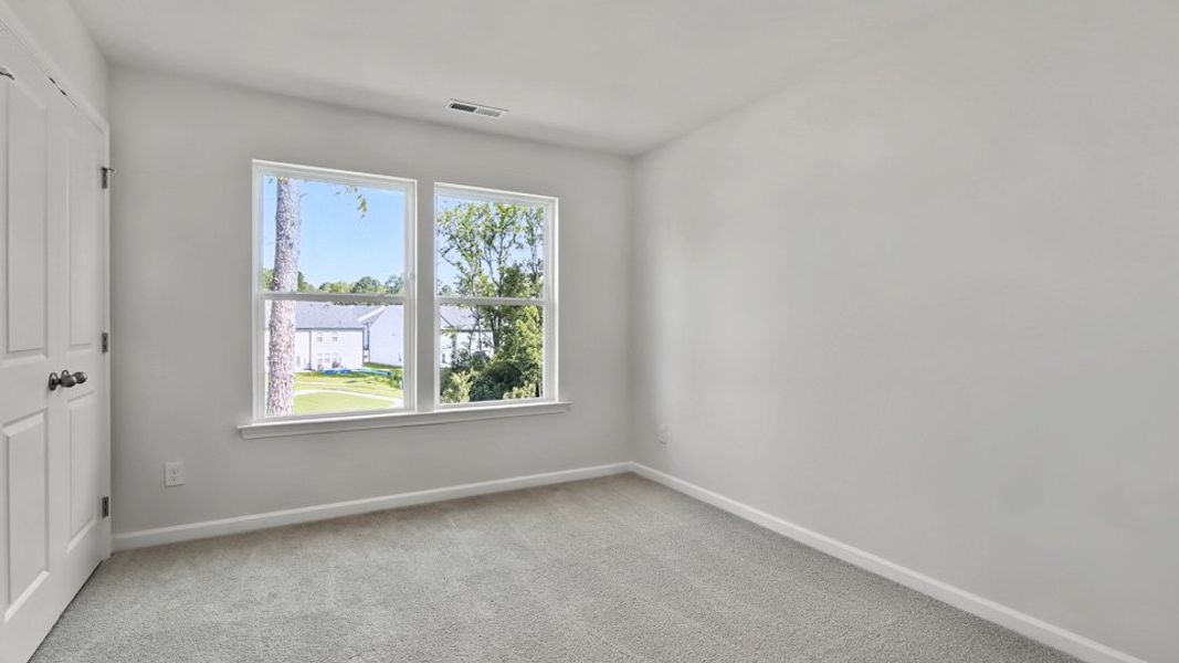 Spacious, unfurnished interior of a new home in Copper Run South, Durham (Image 23).