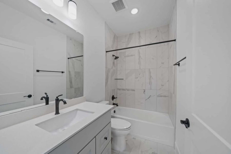 Representative furnished interior of a home built from the Waterloo by Chesmar Homes in Attwater 65's, Waller (Image 8).