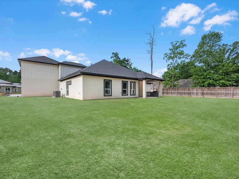 Front exterior of a new home in , Dayton, TX, highlighting curb appeal (Image 19).