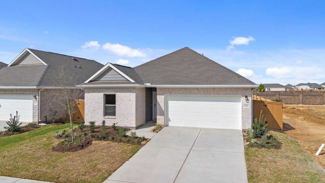 Front exterior of a new home in Cypress Green, Hockley, TX, highlighting curb appeal (Image 2). Front exterior of a new home in Cypress Green, Hockley, TX, highlighting curb appeal (Image 2).