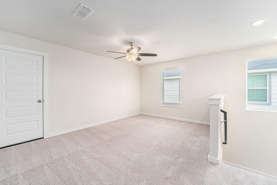 Large upstairs loft/game room is located at the top of the stairs and is perfect for a kids play area, movie room or just a relaxing place to study or read. Full size door leads to the decked attic which is perfect for storage! Large upstairs loft/game room is located at the top of the stairs and is perfect for a kids play area, movie room or just a relaxing place to study or read. Full size door leads to the decked attic which is perfect for storage!