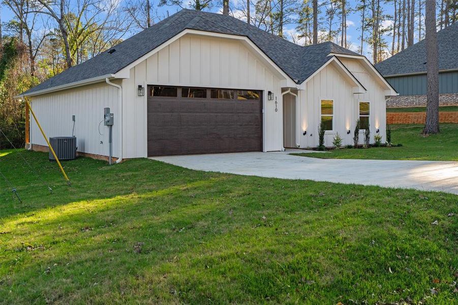 Front exterior of a new home in , Hideaway, TX, highlighting curb appeal (Image 25).