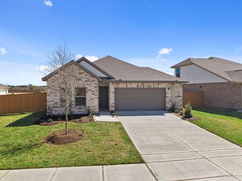 Front exterior of a new home in Cypress Green, Hockley, TX, highlighting curb appeal (Image 22).