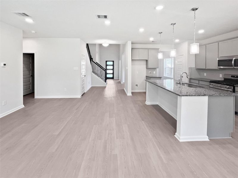 The Princeton II- Family Room and Kitchen. Home under construction, image used for illustrative purposes only, colors and options will vary. The Princeton II- Family Room and Kitchen. Home under construction, image used for illustrative purposes only, colors and options will vary.