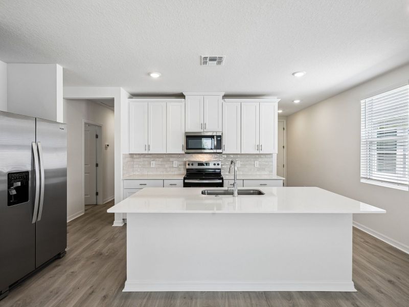 Furnished interior view inside a new home in Hamilton Bluff - Classic Series, Haines City (Image 3).