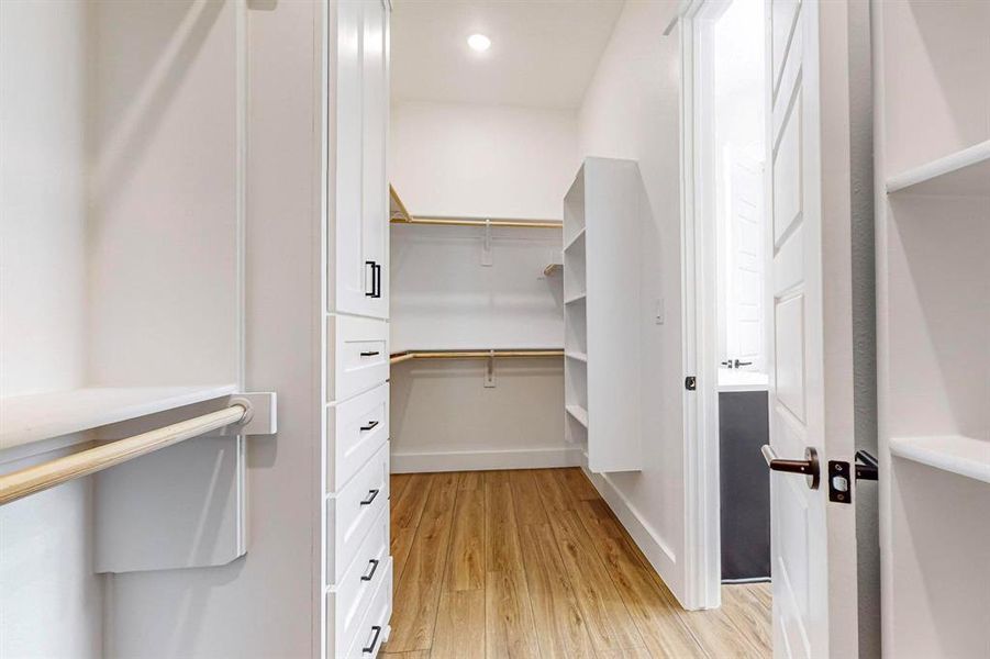 Walk in closet featuring light hardwood / wood-style floors