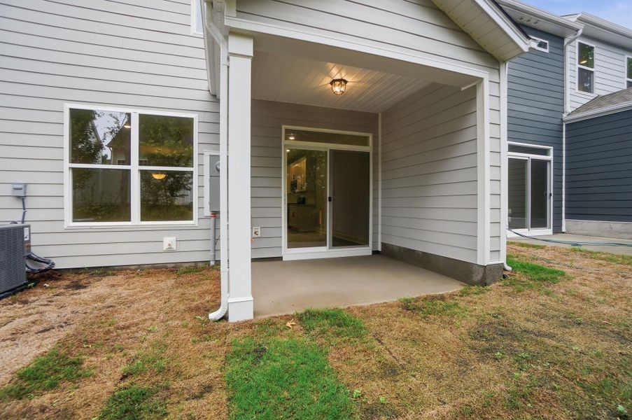 Exterior details and patio area of a home in Harrisburg Village Townhomes, Harrisburg (Image 4).