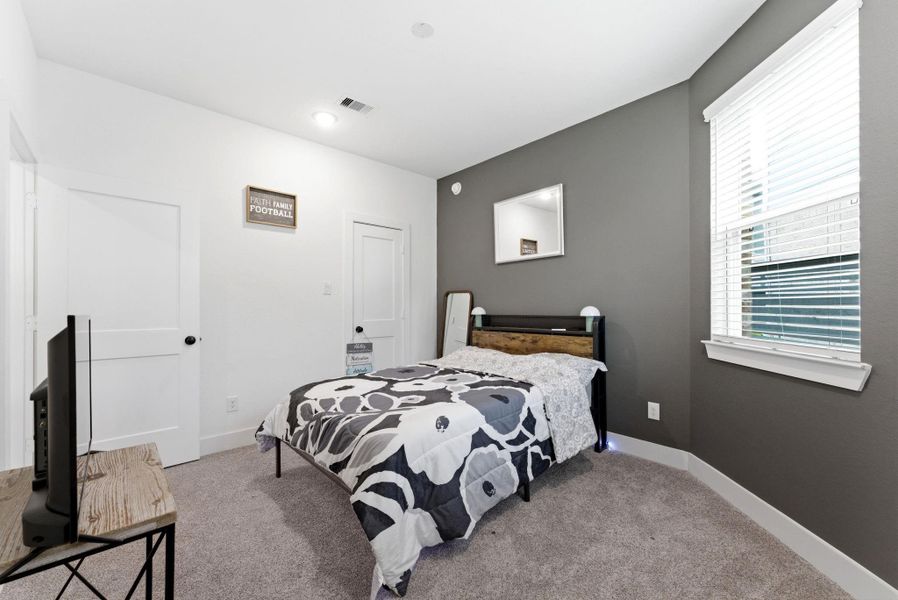 Generously sized bedroom offering plenty of space for furniture and personal style.