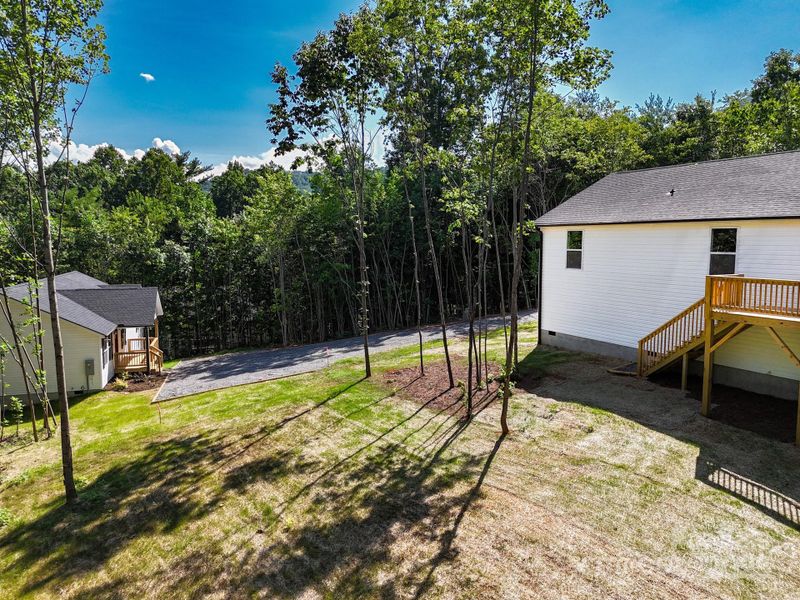 Front exterior of a new home in , Candler, NC, highlighting curb appeal (Image 20).