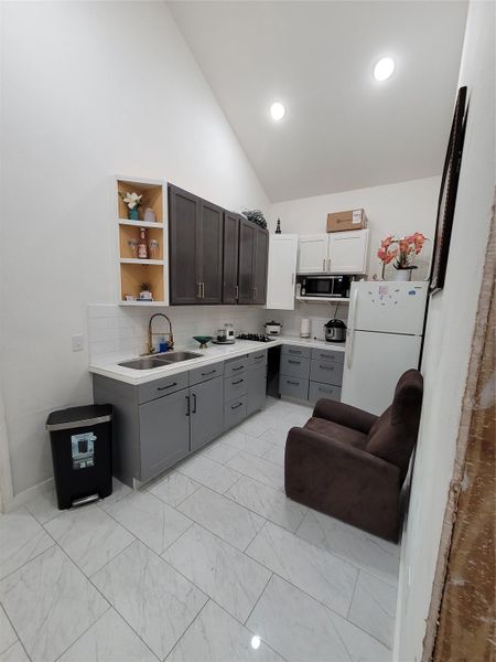 A well-appointed bathroom features a contemporary vanity, modern fixtures, and ample lighting. A well-appointed bathroom features a contemporary vanity, modern fixtures, and ample lighting.