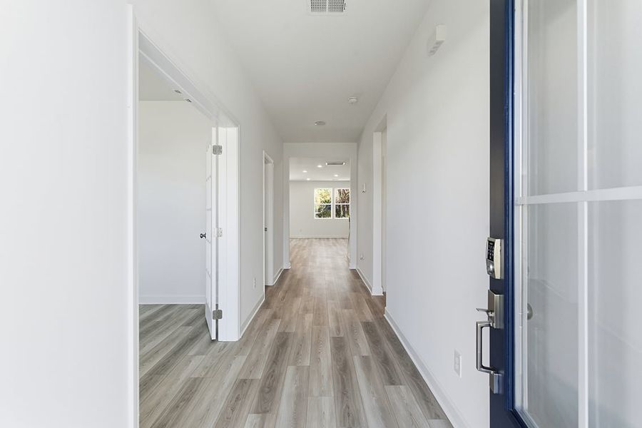 A hallway with white doors.