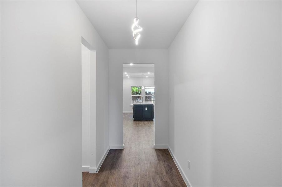 Hallway featuring dark wood-type flooring