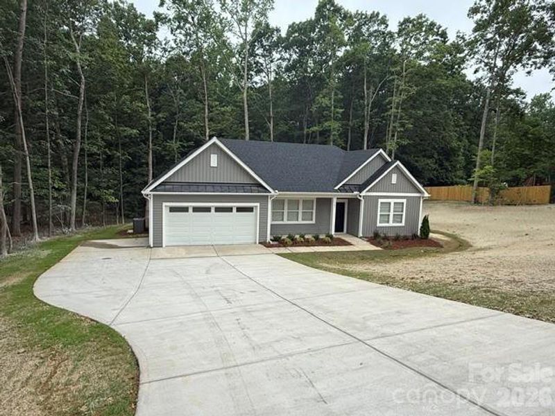 Front exterior of a new home in , Spencer, NC, highlighting curb appeal (Image 1). Front exterior of a new home in , Spencer, NC, highlighting curb appeal (Image 1).