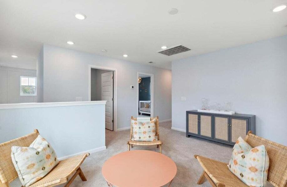 Furnished interior view inside a new home in Sweetgrass at Summers Corner, Summerville (Image 8).