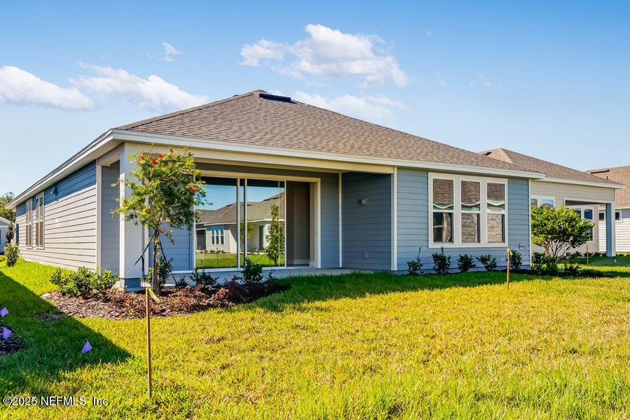 Exterior details and patio area of a home in Colbert Landings, Palm Coast (Image 3).