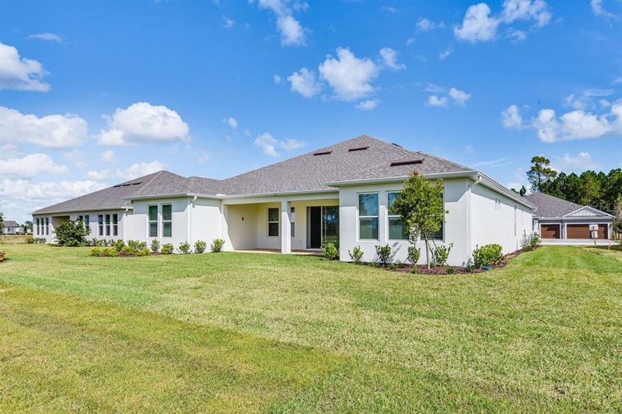 Exterior details and patio area of a home in Ardisia Park, New Smyrna Beach (Image 3).