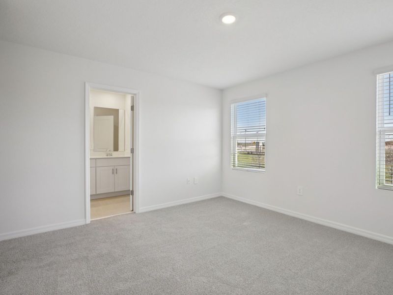 Spacious, unfurnished interior of a new home in The Reserve at Hammock Oaks Townes, Lady Lake (Image 11).