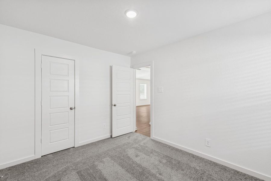 Spacious, unfurnished interior of a new home in Pinewood at Grand Texas, New Caney (Image 12).