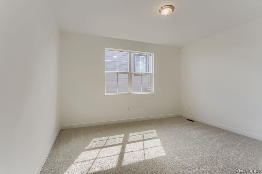 Spacious, unfurnished interior of a new home in Sunset Village: The Grand Collection, Erie (Image 9).