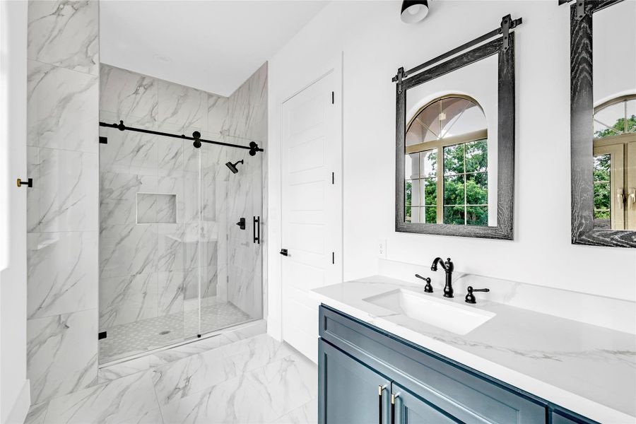 En-suite bath 3 with large shower & lots of natural light