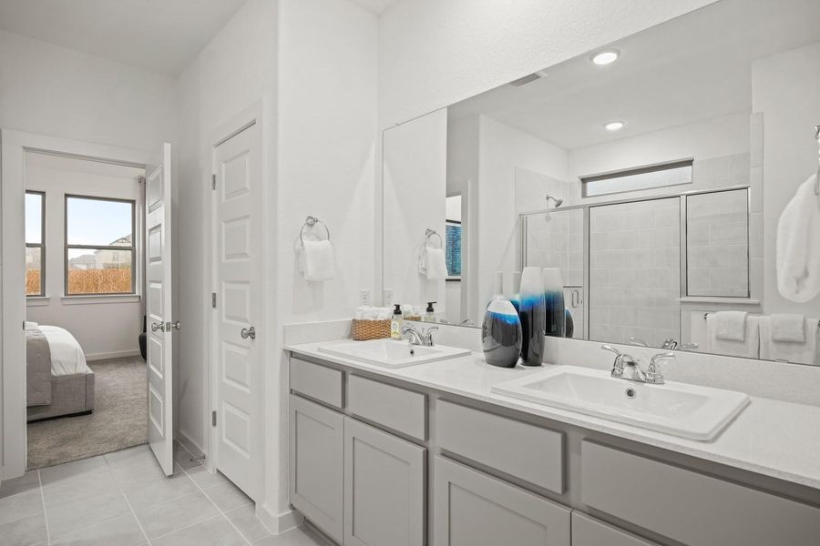 Primary bathroom in the Oak home plan by Trophy Signature Homes – REPRESENTATIVE PHOTO