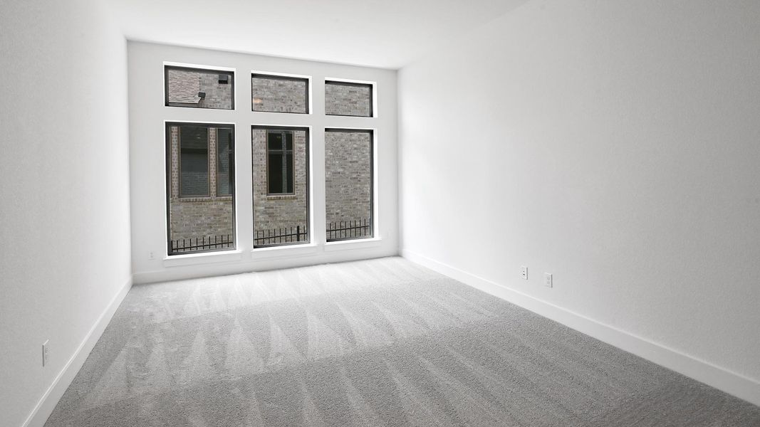Full bathroom featuring a freestanding bath, vanity, vaulted ceiling, a shower, and tile patterned floors