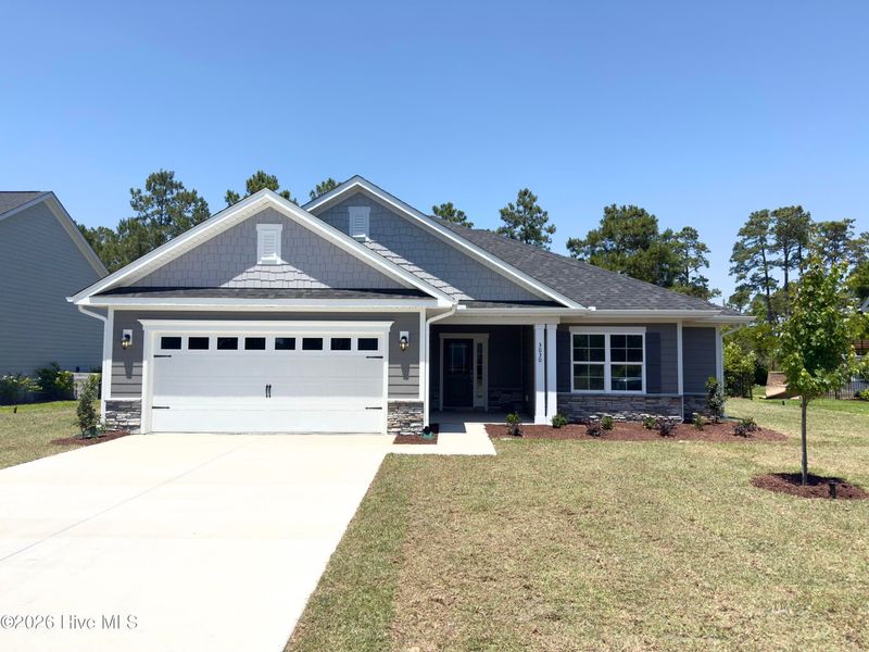 Front exterior of a new home in Rutledge, Shallotte, NC, highlighting curb appeal (Image 1). Front exterior of a new home in Rutledge, Shallotte, NC, highlighting curb appeal (Image 1).