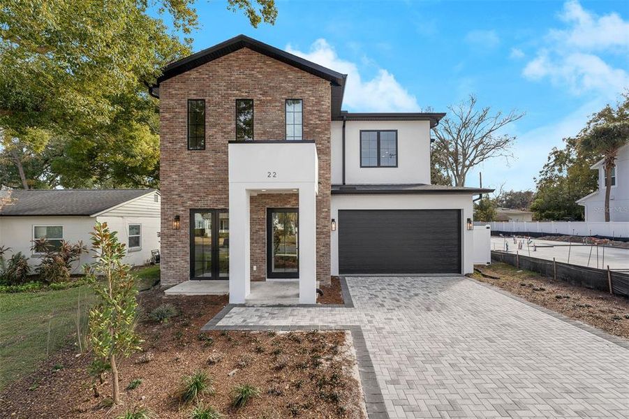 Front exterior of a new home in College Park, Orlando, FL, highlighting curb appeal (Image 1). Front exterior of a new home in College Park, Orlando, FL, highlighting curb appeal (Image 1).