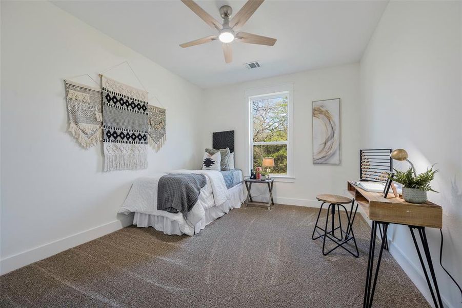 Just down the hall on the rear side of the house, you'll find an additional secondary bedroom with uninterrupted views of it's lush surroundings. Featuring walk-in closet with exceptional built-ins, brand new carpet, and ceiling fan.