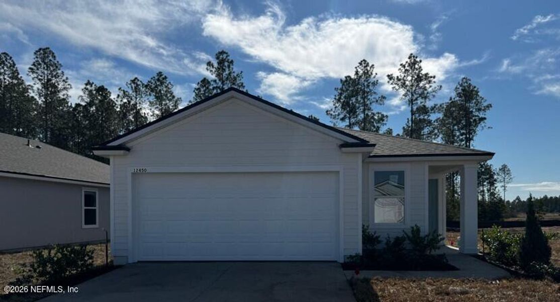 Front exterior of a new home in Copes Landing, Jacksonville, FL, highlighting curb appeal (Image 2).