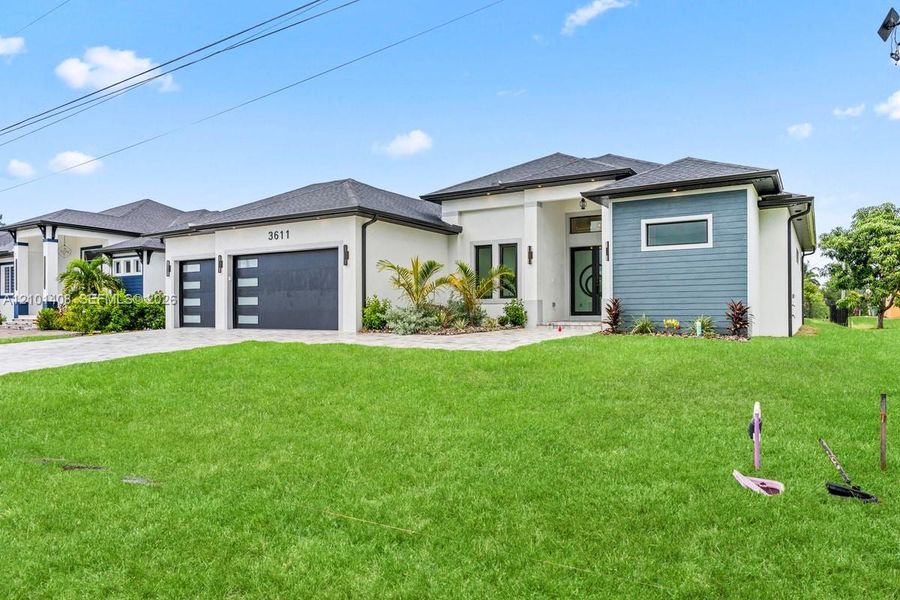 Front exterior of a new home in , Cape Coral, FL, highlighting curb appeal (Image 25).